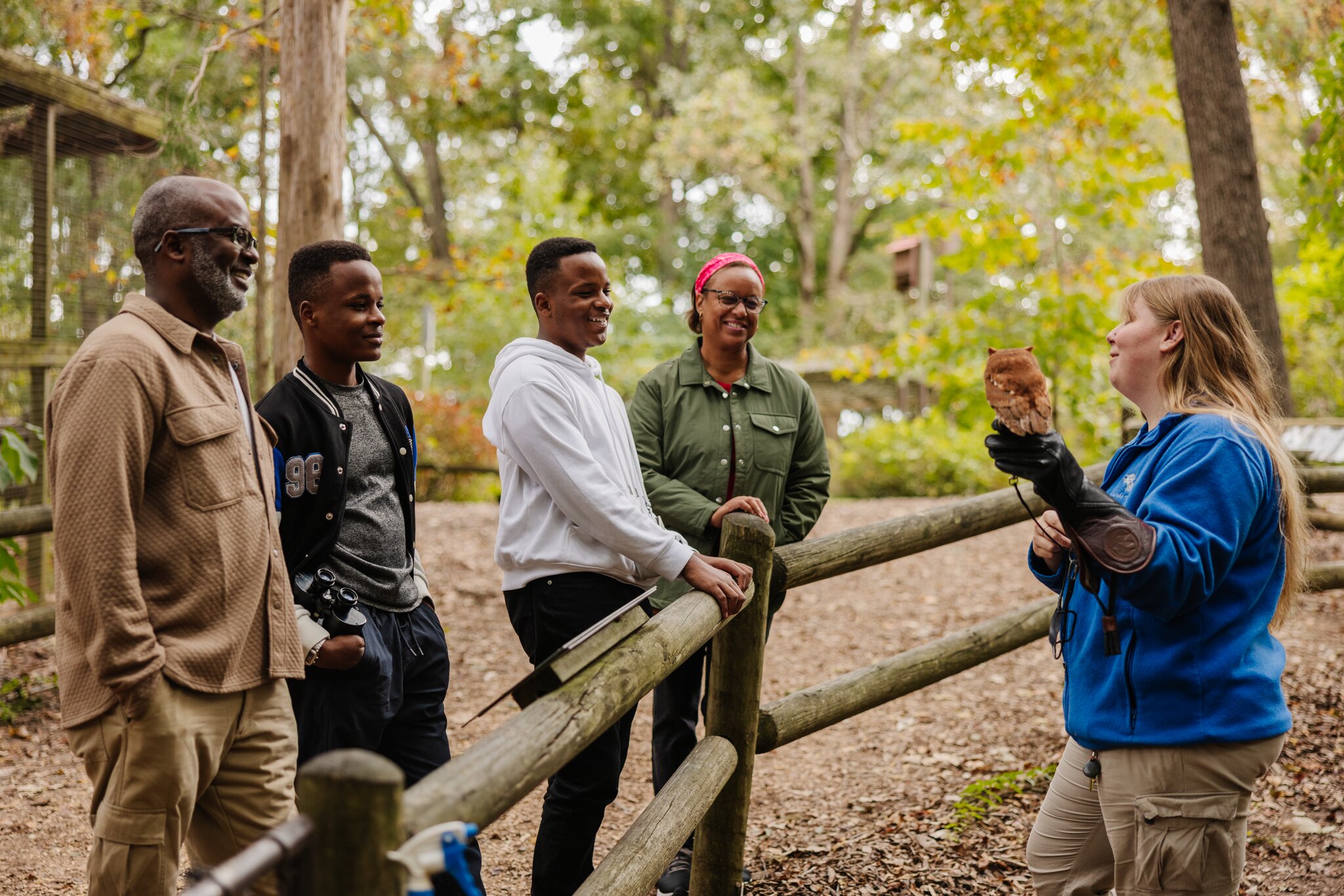 Family looking at owl at Woodlands Nature Station in Kentucky