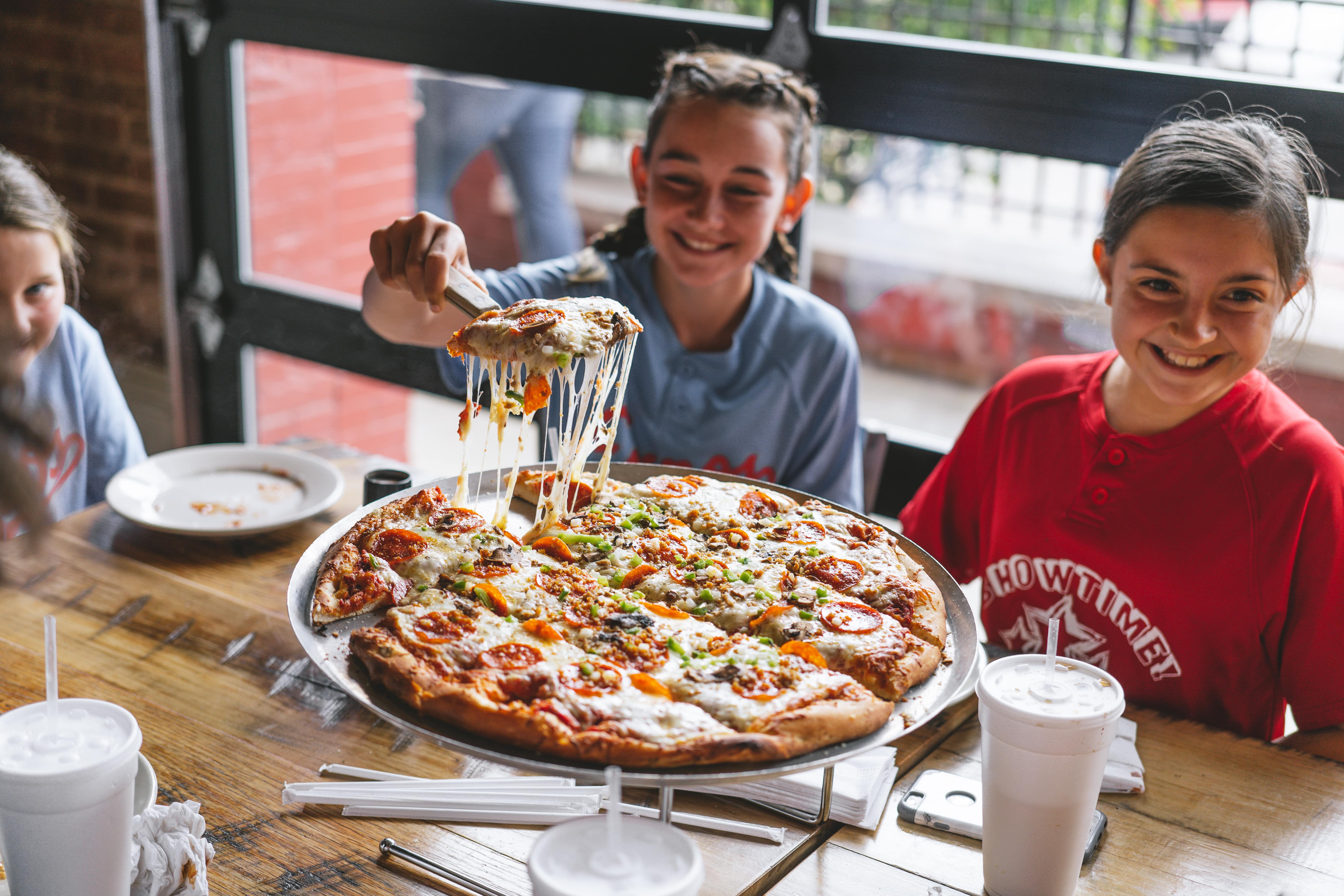 Enjoying pizza in Elizabethtown. 